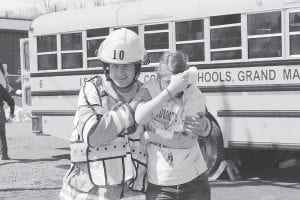 The Cook County Emergency Services Conference offers a multitude of training opportunities. Over the last 25 years, emergency responders have practiced responses to mock plane crashes, vehicle fires, hazardous material spills, search and rescue operations, airbag explosions, and much more. Here, a Hovland firefighter gets practice at the scene of a bus crash. The next conference will be April 25 - 26.