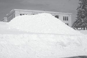 This winter county workers put some of the excess snow on the Cook County courthouse lawn, building the pile so high it obstructed the view of the courthouse when driving by on West 2nd Street. When it wasn’t below zero, it snowed this winter, and as of Thursday April 17, it is still snowing.