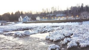 Highway 61 became impassable for over an hour on Thursday, April 10 when a creek near Outpost Motel in Colvill overflowed, carrying large chunks of ice and slush across the road.