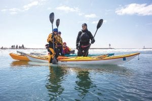 Spring fever to the extreme. This group of kayakers—dressed in dry suits and life vests—ventured out kayaking on Lake Superior on Friday, April 18. Guided by local photographer and guide Bryan Hansel of North Shore Expeditions, the group floated amongst the ice in the Grand Marais harbor. Here, they ventured onto an “ice cake,” which is smaller than an actual iceberg. The friends are (L-R) Katie Forseth Katzner, Michelle Forseth, Aaron Katzner and Jeffrey Forseth.