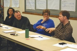 Lake Superior Trading Post owner Eric Humphrey explains his views on a GreenStep City Best Practice to a group of 22 community leaders who gathered to discuss the program and brainstorm options. The public is invited to do the same next Monday, April 28, 7:00 p.m. at the Community Center. From left, Ilena Berg, Cook County Soil and Water; David Demmer, Cook County Planning and Zoning; and County Commissioner Sue Hakes listen.