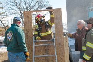 There was plenty of training action at the 25th annual Cook County Emergency Services Conference on Friday and Saturday, April 25-26. At the Grand Marais Recreation Park, a live burn trailer and this smoke-filled obstacle course gave firefighters the experience of entering a dark, confined, space. Colvill Firefighter Willie Olin makes his way out of the maze. See more about the conference on page A7.