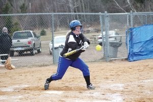 Upper left: Maddy Roy gets set to drive the ball for a single last week in a home game against Cromwell. The Vikings won 19-8. Above: With a runner heading to third, Zoe Anderson throws out the runner (No. 10) heading for first base. Left: Sarah Deschampe slides safely home to score a run for the Vikings in their game against Cromwell.