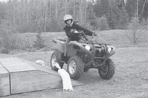 A youth ATV safety student maneuvers an ATV on a simulated side hill during an ATV safety course. Registration is open now at Cook County Community Education for the 2014 course. Anyone born after July 1987 must have this training to ride an ATV in the state of Minnesota.