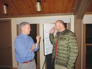 Following the affordable housing information and strategy meeting at Lutsen Resort on Tuesday, April 29, Scott Harrison (left) and Cook County Administrator Jay Kieft discuss housing options for not only West End residents, but all residents of the county. Harrison, who owns Lutsen Resort, is also on the Cook County/Grand Marais Economic Development Agency (EDA) board, which has for several years looked for ways to make housing more affordable for new and existing residents.