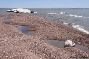 Hovland photographer Sandy Updyke has been chronicling Lake Superior’s ice this winter. On her latest walk on the beach on May 4, Updyke said the beach was still frozen underneath so the beach gravel and sand had interesting pockets of water.