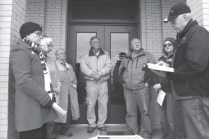 While in recent times some atheists and non-religious people have proclaimed the first Thursday in May as the “National Day of Reason,” others still observe the day that Congress set aside in 1952 as the “National Day of Prayer.” Seven Cook County residents gathered on the courthouse steps and spent an hour praying for the religious, political, police, military and educational leaders of the county, state and country. (L-R) Rae Piepho, Kathy Kippley, Robin Derscheid, Fred Cain, Mark and Melissa Breitsprecher and Butch Piepho.