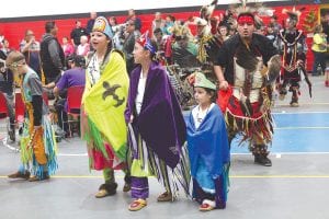 The sound of the traditional drum reverberated in the hallway of the Grand Portage Community Center on Saturday, May 10, 2014, calling dancers to enter the circle at the annual Honor Our Elders Powwow. Taking part in the Grand Entry were Grand Portage Royalty (L-R) Princess Samantha Scalise, Junior Princess ShaeLyn Novitsky, and Tiny Tot Princess Holly Dahl.