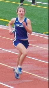 CCHS track runners had a good day at the Matt Kero Memorial held on the Denfeld track on May 9. Upper left: Maya McHugh, baton in hand, runs a leg in the 4x800 relay. Above: Blasting down the track in the 100-meter dash, Will Lamb proves he’s almost as fast on his feet as he is on his skis. Left: Cy Fortunato gets comfortable in the blocks before taking the opening leg in the 4x100 meter relay.