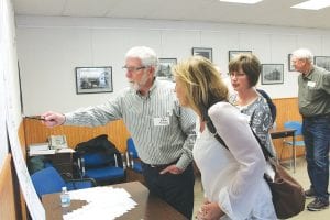 The community had the opportunity to talk to representatives of the Cook County/Grand Marais Economic Development Authority at an open house on Tuesday, May 13. There were people available to talk about EDA housing programs, the renovation of Superior National at Lutsen golf course, the Small Business Development Center, and the Cedar Grove Business Park. Here, Realtors Jack and Sandra McHugh share information about the business park with Cook County Visitors Bureau Director Linda Kratt.