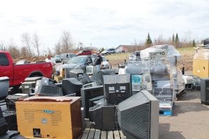 The recycling collection event in Grand Marais on Saturday, May 17, which accepted old computers, TVs, stereo components, microwaves, and miscellaneous other electronics and small appliances, was apparently a huge success. Cars and trucks loaded with old and broken electronics were lined up for several blocks down 5th Avenue. The truck brought by the recycling company, TRC, was not big enough to take it all. The company had to return a few days later to remove the massive pile of waste electronics. Another collection will be held at the Tofte Transfer Station on Saturday, July 19.