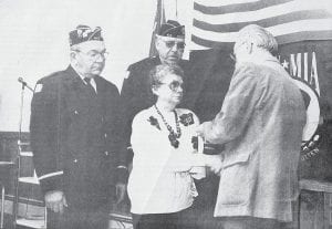 A special honor was bestowed just before Memorial Day in 1989. This photo appeared in the March 6, 1989 News-Herald with the following caption: Cecilia “Sis” Kesanen accepted a posthumous award of the new prisoner-of-war medal for her late husband, Roy Kesanen. He was captured by the enemy in 1944 when the aircraft on which he served as a gunner was shot down over the Netherlands. The award was presented by Cook County Veterans Service Officer Bob Altrichter at American Legion Post 413. Looking on are Legion Members Glenn Bergstrom and Jim Johnson.