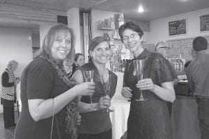 Community members gathered at Surfside Resort in Tofte on Saturday, May 17 for the Gala for the Grove, an elegant affair benefitting the Birch Grove Community School. Friends Kari Merritt, Emily Lien, and Sara Silence visit before the wonderful dinner prepared by Chef Judi Barsness.