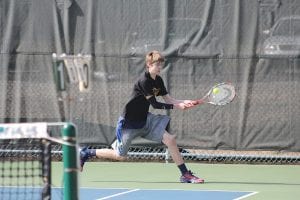 Lucas Phillips gets set to hit a forehand winner on this play in his singles match in a game against Marshall played on the Vikings' home tennis courts.