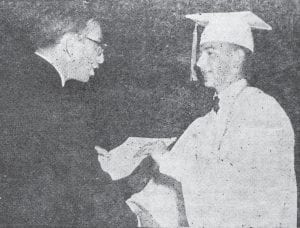 The Cook County High School class of 1964 was hailed as the largest ever, with 70 graduates receiving their diplomas June 5 in the school auditorium. It was also the first year that no valedictorian or salutatorian was named. C.W. Wood, personnel director at UMD, delivered the keynote speech and told the grads that three things are necessary for success: a student must have a goal; he must have drive, determination and motivation to reach that goal; and he must be willing to work to achieve what he sets out to do. Shown in this News-Herald photo commemorating the occasion are Donn Boostrom, right, receiving his diploma and congratulations from Principal Leonard Sobanja. It was the 55th annual graduation ceremony to be held at the school.