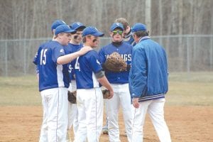 Head Coach Arleigh Jorgenson talked strategy with his baseball team at a recent game. The Vikings were regulated to practicing inside for much of the spring, but when their chance to play outside came, they surprised several teams in the play-offs.