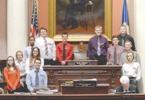 Douglas “DJ” Fincel of Grand Marais spent a week at the State Capitol, May 5-9, serving as a page in the Minnesota House of Representatives. He is pictured here with the other House pages (back row, third from the left) standing next to the desk of the Speaker of the House.