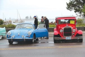 Above: Roger Flink of Lutsen chatted with car show visitors by his Porsche coupe.