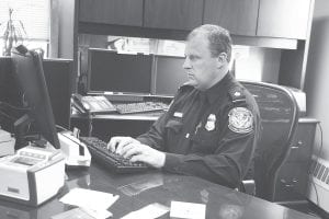 Brian King, seated at his computer, was at the Grand Portage border recently introducing the “Global Entry Program” to the U.S. Customs staff. King is the port director/public affairs liaison for the U.S. Customs and Border Protection Agency. The program will allow low-risk travelers to pass through airports and Customs much quicker than those who aren’t in the program.