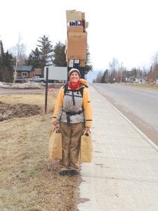 Congratulations to Yvonne Mills of Grand Marais, who multitasks while “Movin’ It!” Mills walks to the Cook County Recycle Center with her items to be recycled. She was nominated by Debbie Benedict (pictured with Yvonne in the inset), who snapped the picture of Yvonne on her way to the recycle center.