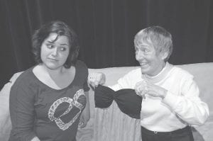 The other play in the repertory is Nana’s Naughty Knickers, a hilarious presentation about a granddaughter (Yvonne Block, on left) who discovers that her “sweet grandma” (Jan Healy) is running an illegal boutique from her New York apartment.