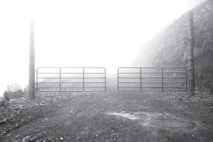 The road that was going to lead to the Superior Ziplines is padlocked when wetland mitigation work is not being done. It made a dreary picture on the foggy morning of June 12, 2014.