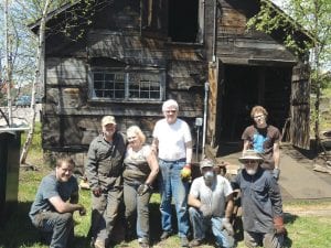 The Cook County Historical Society acquired the Bally Blacksmith Shop property in August of 2013 and has been working on restoration of the historic building. Working as cleanup crew recently were (L-R) Drew Johnson, Duane Ege, Jeannie Johnson, Bob Pratt, Mike McHugh, Al Taenzer, Nate Carlson.