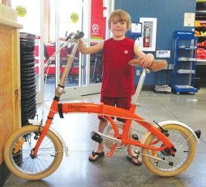 Honest Tea Organic and Fair Trade Tea Company hosted a sweepstakes during the month of May 2014 at the Cook County Whole Foods Coop in Grand Marais. Many shoppers hoped to win the foldaway bike. Landon Sheils of Grand Marais was the lucky winner.