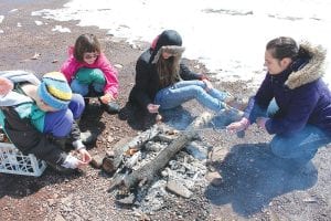 The sale of Girl Scout cookies supports many activities, such as this spring’s outdoor skills training. Girl Scouts and leaders learned knot-tying, how to pitch a tent, start a fire, cook over a campfire and more.