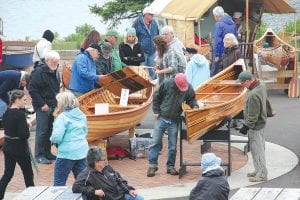 Visitors to the North House Folk School campus were treated to an amazing array of boats during the 2014 Wooden Boat Show on June 20-22. People marvel at all the detail that goes into the boats.