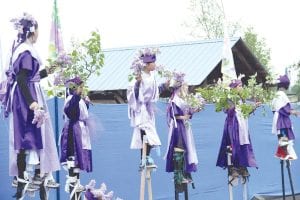 The North House Folk School campus on the Grand Marais waterfront was buzzing with activity this weekend during the 2014 Wooden Boat Show. A highlight of the weekend was the Summer Solstice Pageant on Saturday, June 21. The pageant included caribou, butterflies, fish, and these fragrant lilac bearers. See more about the Wooden Boat Show and Solstice Pageant on page A3.