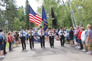 Top: American Legion Post 413 started off the 4th of July festivities by leading the parade in Tofte. They also led the evening parade in Grand Marais. Above: Kids of all ages had a blast at the West End 4th of July celebration, including these women who donned Uncle Sam hats and boogied to the music of Cook County’s Most Wanted.