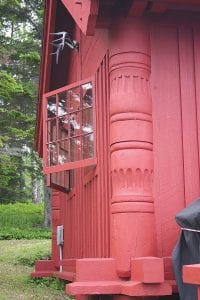 Post-and-beam construction can be straightforward, or in the case of Architect Edwin Lundie, posts, like the one on this cabin, were designed and carved in many ornamental designs to add beauty to the buildings.