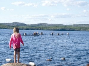 A perfect day for paddling—or watching the action from the shore. This little girl found a great spot to watch the Gunflint Canoe Races on Wednesday, July 16. See more of the canoe race action on page B1.