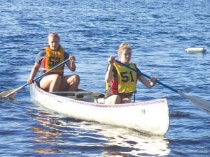 Gliding back to shore after the regular paddling race are Emily Jacobsen (back) and Shauna Blake.