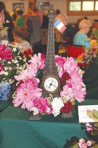 The theme for the West End Garden Club’s July 19 Flower Show was Around the World in 80 Bouquets and yes, there were 80 bouquets! This one by Anita Smith captures Springtime in Paris.