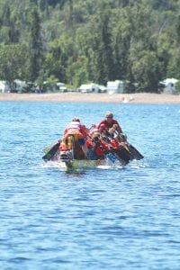 On Saturday crowds lined the beach to watch the fast and furious dragon boat paddlers.