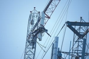 There was some exciting activity on the Sawtooth Mountain ridge overlooking Grand Marais on July 23-24 as an old communications tower was dismantled and a new tower erected by workers with Vertical Limits. This worker, tethered for safety, guides the top of the 350-foot tower into place.