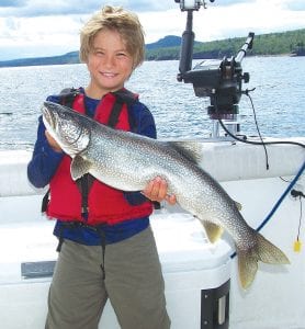 Becket Matz, 9, from Deephaven, Minnesota caught this 8-pound lake trout while fishing with Captain Darren Peck of Tofte Charters on July 27.