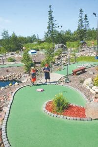 Anticipation arises in the young man who putted the ball as it races toward the cup. His buddy threw his hands up in celebration when the ball went in. The boys were playing recently on the Putt N' Pets Mini Golf course, which was the site of the Fisherman’s Picnic Mini Golf Tournament.