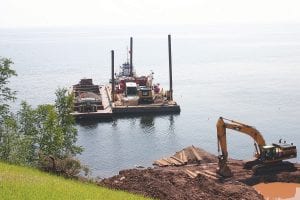 Marine Tech L.L.C. of Duluth has been busy these past few weeks dredging for the approximately 2-mile pipeline that will carry water from Lake Superior to businesses and residences tat the top of the Lutsen Ski Hill. Much of the water will be used by Lutsen Mountains to make snow in the winter, and water will also benefit Superior National golf course in the summer when they need it to water greens and fairways. The estimated time to finish the pipeline is spring of 2015.