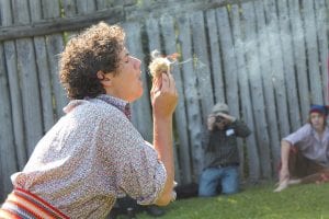 Although these young men did not win the Rugged Voyageur Contest, they gave it their all. Because of the humidity (and according to some, the low-quality government char) the fire starting part of the contest was exceptionally difficult. Above: First up was Daniel Apgore, who was able to get a fire started. Right: Evan Kline took a tumble but still finished with a decent time.