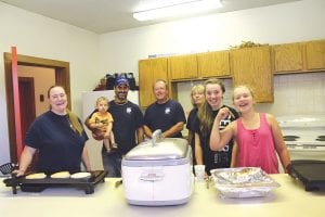 Saturday, August 16 was a day of community in Schroeder during the annual John Schroeder Day celebration. The day started with a delicious pancake breakfast hosted by the Schroeder Fire Department. (L-R) Lynn Christianson, Nate Clay with Sheldon, Fire Chief Phil Bonin, Deb Johnson, Jamie Johnson, Kasey Johnson.