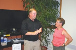 Kurt Anderson discussed the effects sulfates have on wild rice with Barb Heideman after Anderson’s lecture which was held at the Community Education building on August 12. A scientist and gatherer of wild rice, Anderson presented his views to about 25 people who had many questions for him, some he could answer, and some that need more research before they can be answered.