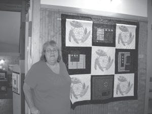 Alta McQuatters, a member of the Schroeder Area Historical Society, worked with the Cross River Quilters to create this exquisite quilt with five intricate dream catchers. McQuatters cross-stitched the dream catchers in honor of her grandfather, White Sky.