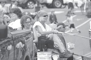 Heidi Sobanja looked over Jan Hanson-Strathy’s shoulder to see if she was having any luck “catching” money in her net. By the looks of it, Jan was nearing her limit of dollar bills. The two were on the class of 1974’s Fisherman’s Picnic float and used the event to raise money for Arrowhead Animal Rescue.