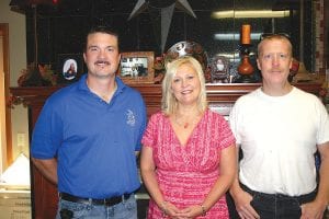 LeAnn Zunker, in the showroom with Bryan Carpenter (left) and Joe Kunshier, has added new staff to 1010 Interiors. Carpenter is a building contractor and can do carpentry work the design firm couldn’t provide in the past and Kunshier, back after a six-year journey, has a wealth of flooring experience.