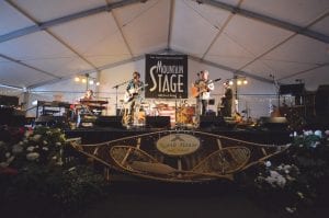 The big tent that has been at the North House Folk School for 13 years will be going up soon to house three great nights of music during Unplugged. Above: For the last three years, West Virginia Public Radio’s Mountain Stage has been part of the event. The Mountain Stage banner will be back again this year on Thursday and Friday night.