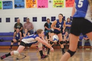 Upper left: Sara Carman stretches mightily to get to a ball just before it hit the floor. Left: Carrie Palmer (16) made a great play on this ball. Above: Britta Andress (9) sends the ball back over the net in the Vikings’ game against the Wrenshall Wrens. The Vikings swept the Wrens 3-0.