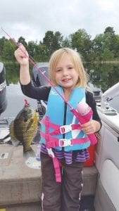 Above: Kaydum Kettunen, 4 years old, caught this nice-sized sunfish on Little Cutfoot Lake near Deer River while fishing with her grandparents Hal and Deidre Kettunen recently. She caught her first fish using a pretty pink Barbie fishing pole.